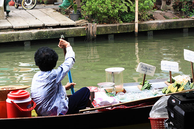 Old Thai Woman Longboat