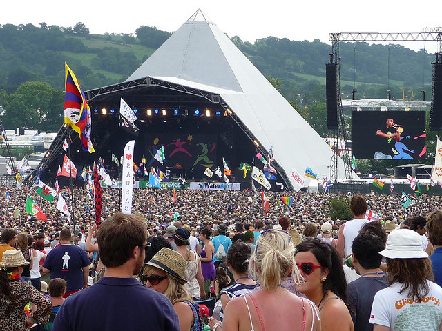 Crowds walking around at Glastonbury Festival in UK